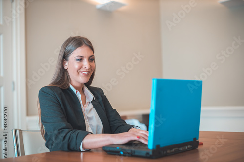 young business woman working on a laptop in the office