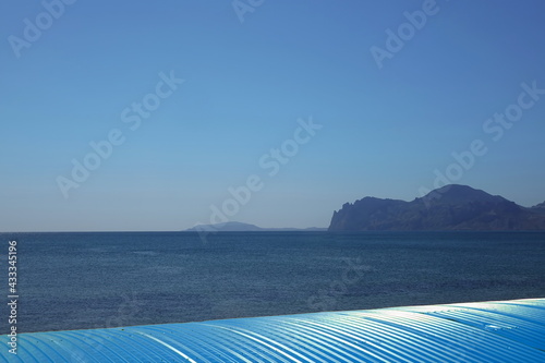 Sunshade Or Canopy Or Awning From Metal Roof Color Background With Sea View And Seascape. Metal Roof Profile Roofing Background With Sea View.