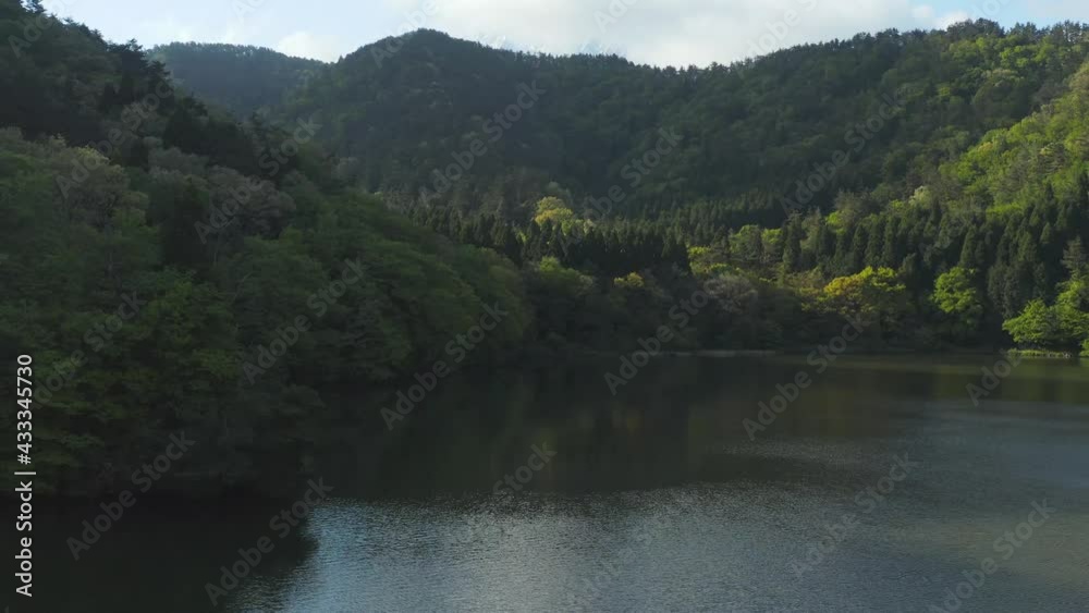 Mt Daisen lake and forests, aerial forward push shot in Tottori, Japan Mt Daisen lake and forests, aerial forward push shot in Tottori, Japan