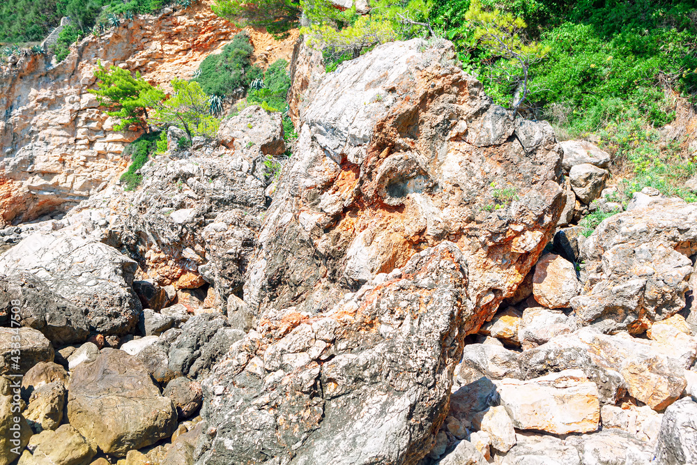 Coastal rockfall landscape . Big stones on the tropical coast 