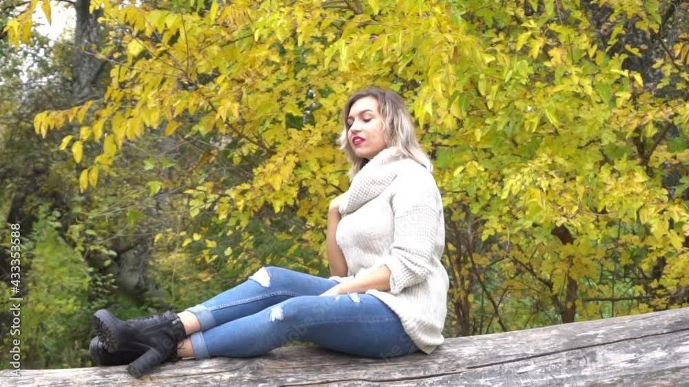 Slow Motion Young fashion girl in autumn park Slow Motion Young fashion girl in autumn park