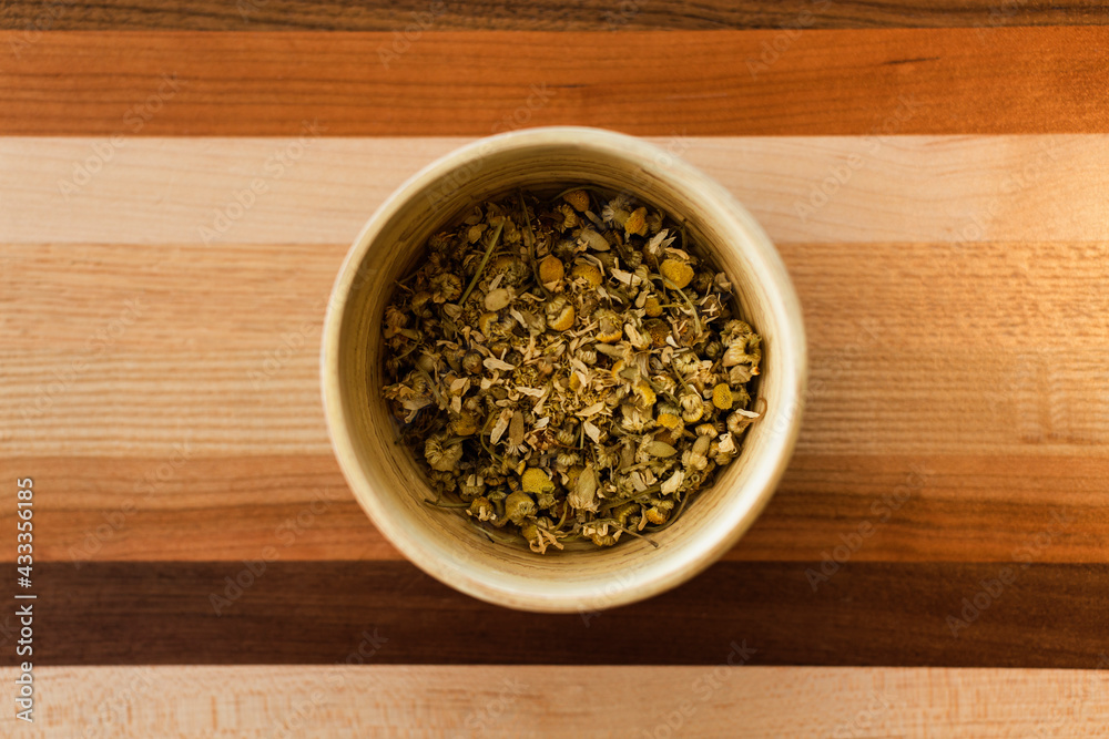 Loose leaf chamomile tea, overhead view, close-up Loose leaf chamomile tea, overhead view, close-up