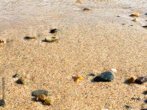 surf on the beach, sandy beach with pebbles