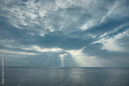 The sun is going to set There was light passing through the clouds.