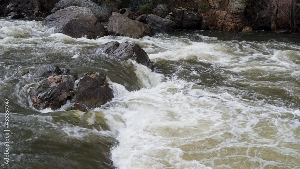 rapids of the Poudre River in a canyon above Fort Collins, Colorado, at springtime high flow rapids of the Poudre River in a canyon above Fort Collins, Colorado, at springtime high flow