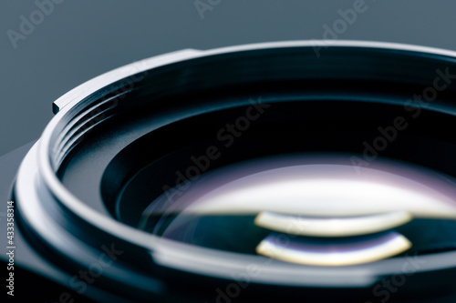 close up shot of vintage camera lens with beautiful reflection of multiple coating layers