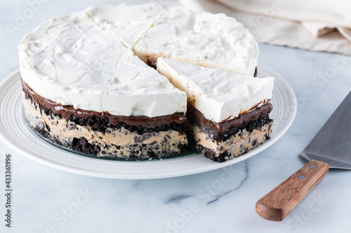 Photos A whole frozen layered pie including mocha ice cream and crushed cookie wafers, with one slice cut out