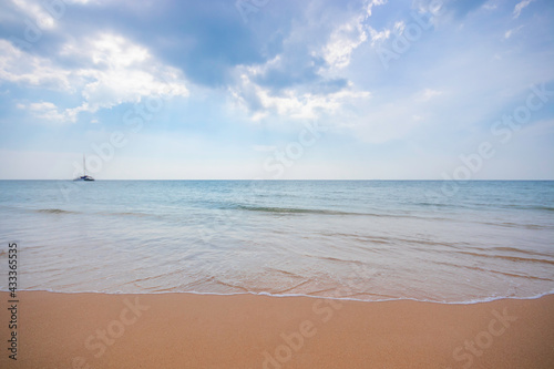 Smooth orange beach And the blue sea © Tony Ruji