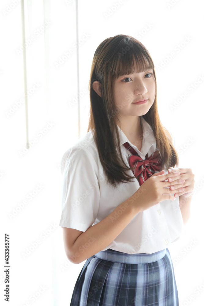 Portrait japanese school girl uniform in white tone bed room Portrait japanese school girl uniform in white tone bed room