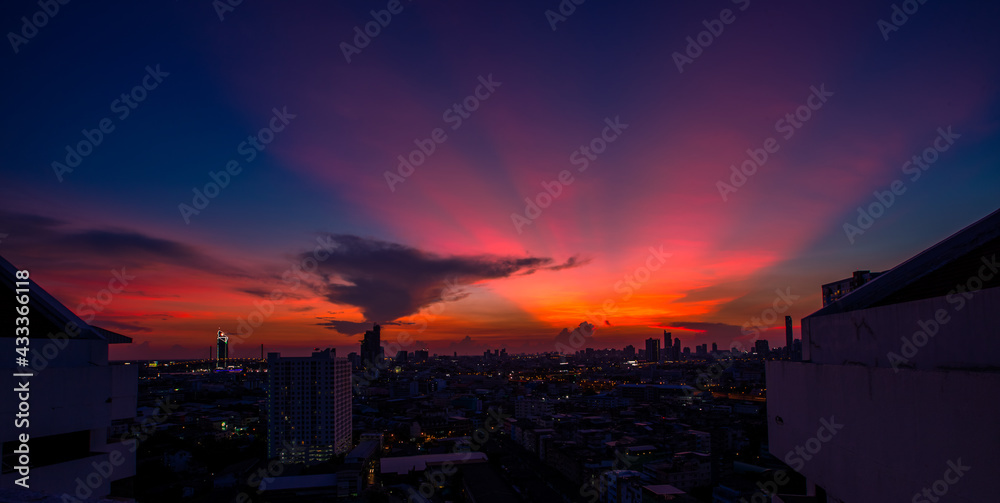 The high angle background of the city view with the secret light of the evening, blurring of night lights, showing the distribution of condominiums, dense homes in the capital community The high angle background of the city view with the secret light of the evening, blurring of night lights, showing the distribution of condominiums, dense homes in the capital community