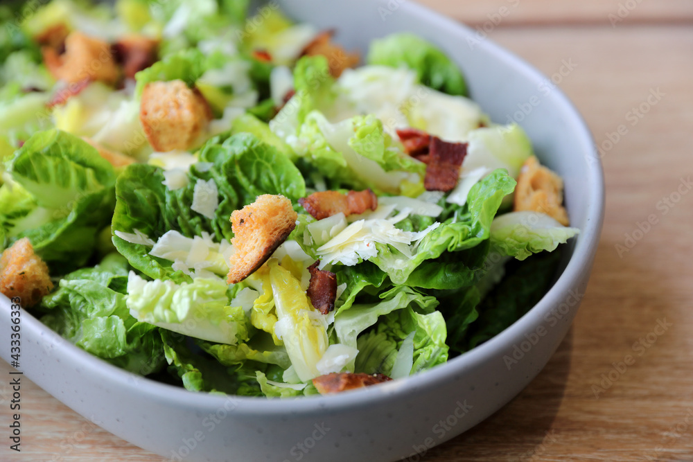 caesar salad appetizer on wooden background caesar salad appetizer on wooden background