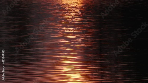 sunset reflection on the water, beautiful water ripples, golden color