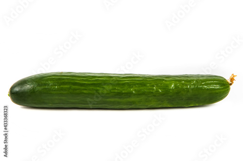 Green cucumber on a white background. Fresh cucumber with yellow inflorescence. Vegetables isolated on a white background. 