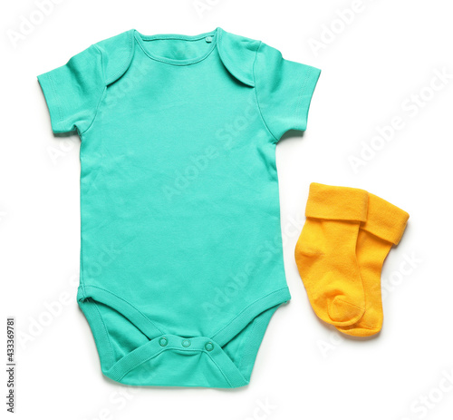 Baby clothes and socks on white background © Pixel-Shot