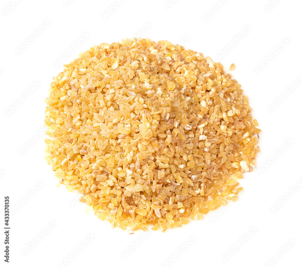 pile of raw wheat groats closeup on white pile of raw wheat groats closeup on white
