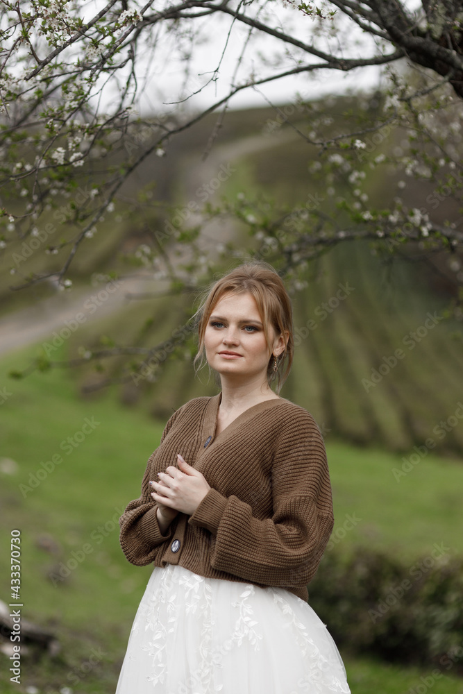 Beautiful bride outdoors in the forest. A boho bride on a tea plantation. Beautiful bride outdoors in the forest. A boho bride on a tea plantation.