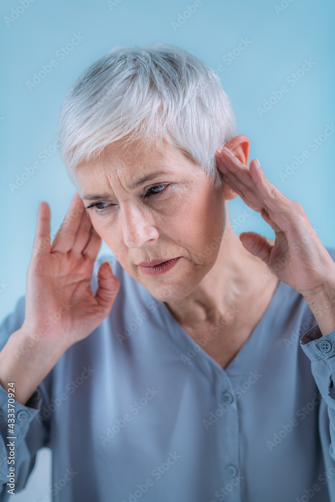 Tinnitus. Senior Woman Suffering From Tinnitus. Tinnitus. Senior Woman Suffering From Tinnitus.