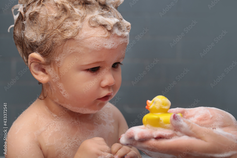 Hygiene and body care for children. Little baby child is washing her hair  in bath. Funny kids face close up. Stock Photo | Adobe Stock