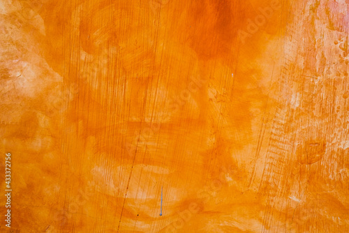 Textured wall brushed painted Background, Abstract Orange Oil Color.