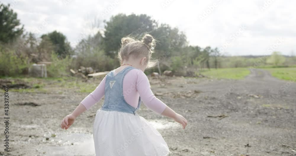 Happy Girl Spinning and Dancing In Puddles Happy Girl Spinning and Dancing In Puddles