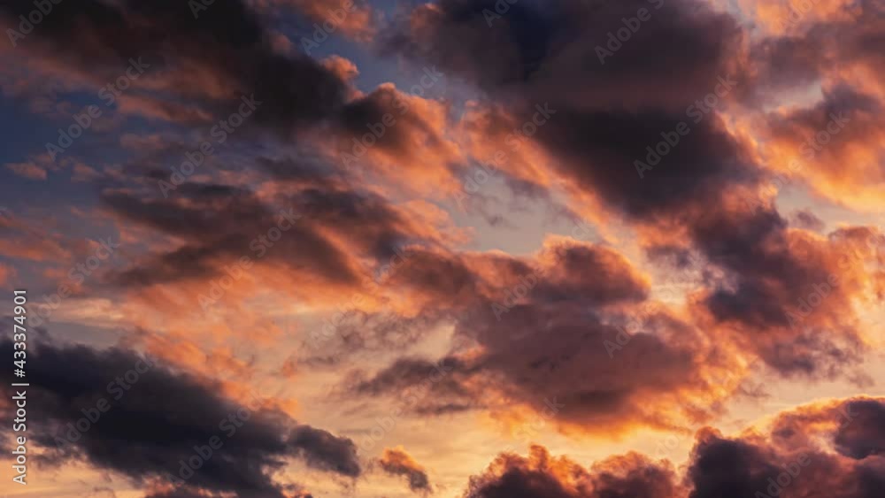 Beautiful clouds at sunset.Timelapse Vivid Clouds Sunset.Brightly Red Cumulus Clouds Swirl at Sunset Beautiful clouds at sunset.Timelapse Vivid Clouds Sunset.Brightly Red Cumulus Clouds Swirl at Sunset