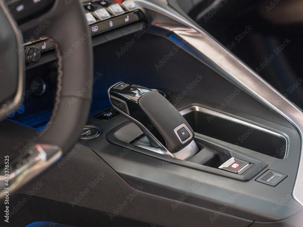 Close-up photo of the electronic gear knob in the car cockpit
