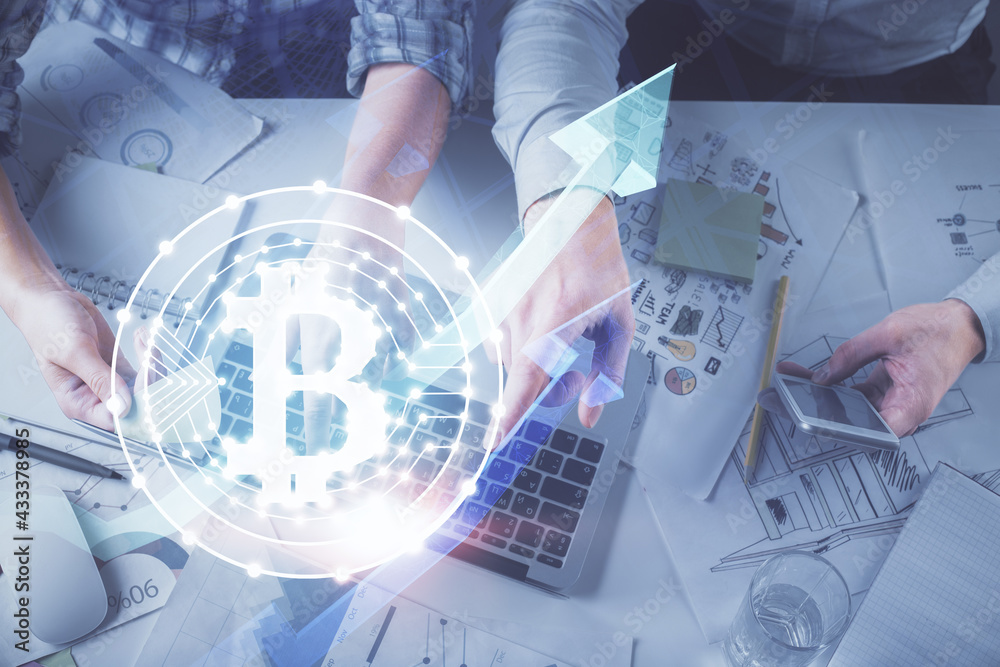 Double exposure of man and woman working together and crypto theme hologram drawing. Computer background. Blockchain concept. Top View. Double exposure of man and woman working together and crypto theme hologram drawing. Computer background. Blockchain concept. Top View.