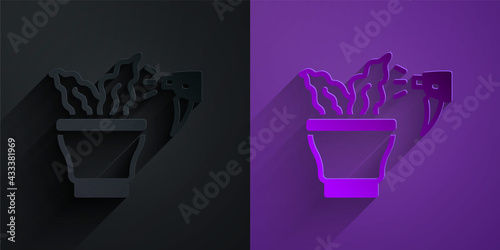 Paper cut Spraying a house plant with a spray gun icon isolated on black on purple background. Moistening of foliage. Care for home flowers. Paper art style. Vector
