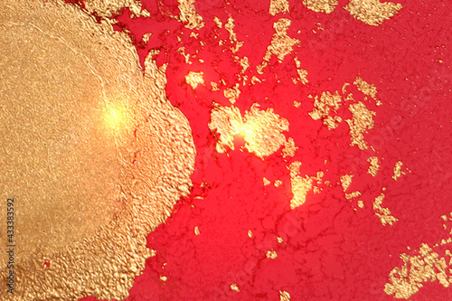 Abstract gold and ruby red marble pattern with sparkles. Vector background in alcohol ink technique. Modern paint with glitter. Template for banner, poster design. Fluid art painting photo