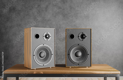 Wooden music speakers sit on a table against the backdrop of a dark loft-style interior. 3d rendering.