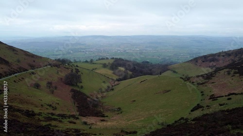 Clwydian range rural mountain valley countryside terrain aerial view across hiking wilderness dolly left photo