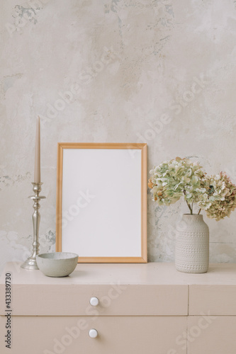 Ceramic vase with dry hydrangea  candlestick on wooden dresser. Comfortable modern interior design. Copy space.