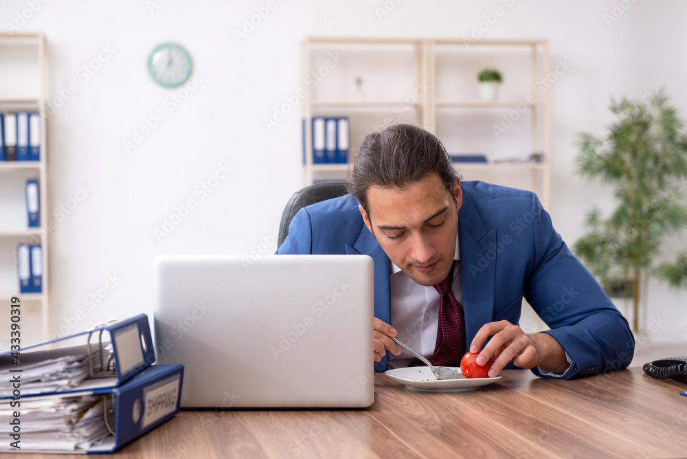 Young businessman working in the office Young businessman working in the office