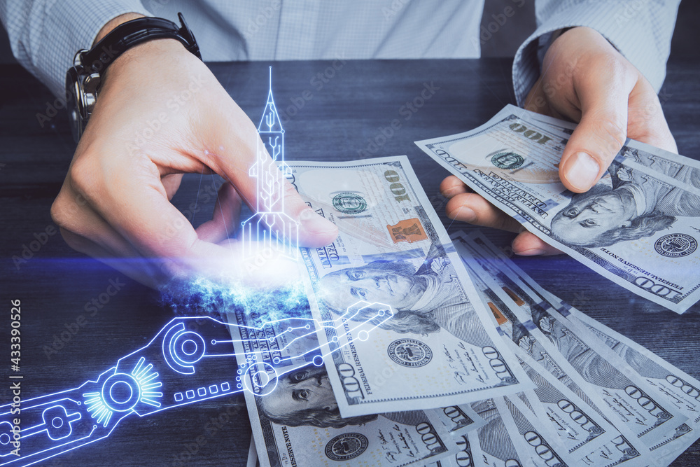 Multi exposure of creative drawing hologram and USA dollars bills and man hands. Start up concept Multi exposure of creative drawing hologram and USA dollars bills and man hands. Start up concept