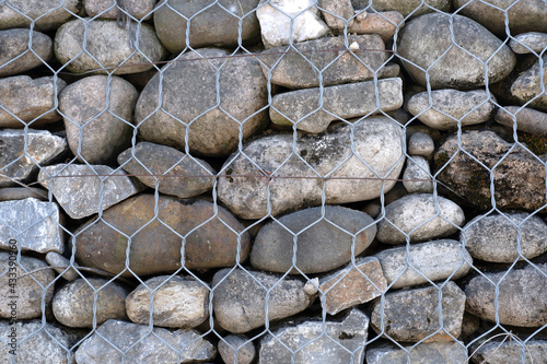Background of stones in wire mesh