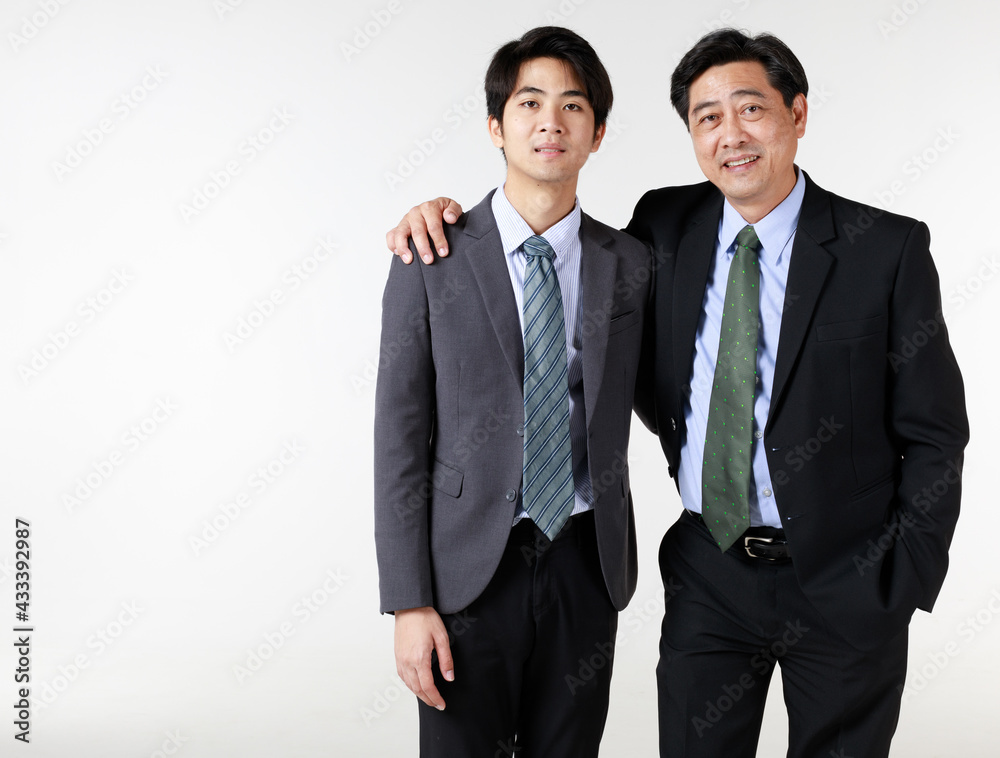 Couple pictures of young men in 2 generation. Older is a successful father or big boss in business..Younger is son who following dad as a partner good teamwork for professionalism soon. Couple pictures of young men in 2 generation. Older is a successful father or big boss in business..Younger is son who following dad as a partner good teamwork for professionalism soon.