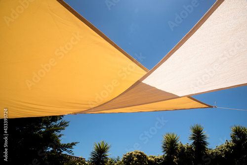 parasol awnings on the outdoor terrace under the blue sky photo