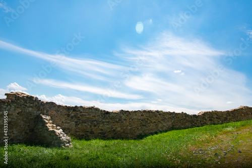 green trees and blue sky in a beautiful visit to the ancient stone fortress