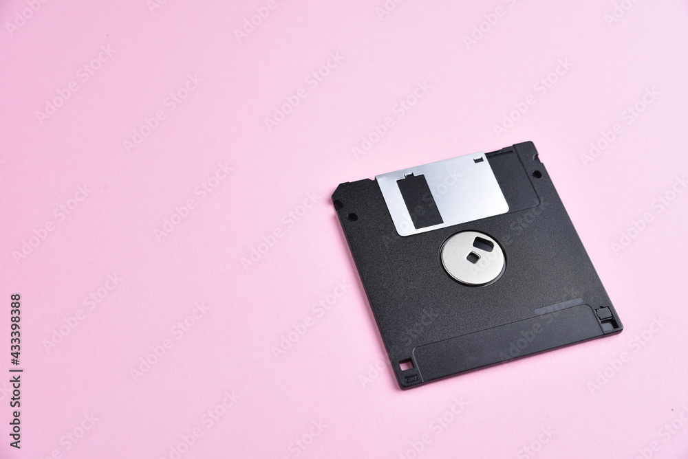 Floppy disk on pink background Floppy disk on pink background