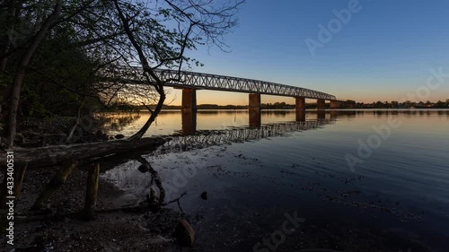 Time Lapse of the old little belt bridge linking the island Fyn (Funen) with Jutland in Denmark. The bridge has been in use since 1935 photo