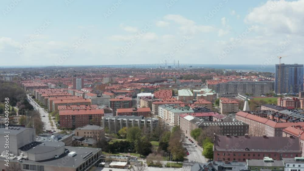 Drone shot over Malmö city with Öresund in the horizon. Drone shot over Malmö city with Öresund in the horizon.