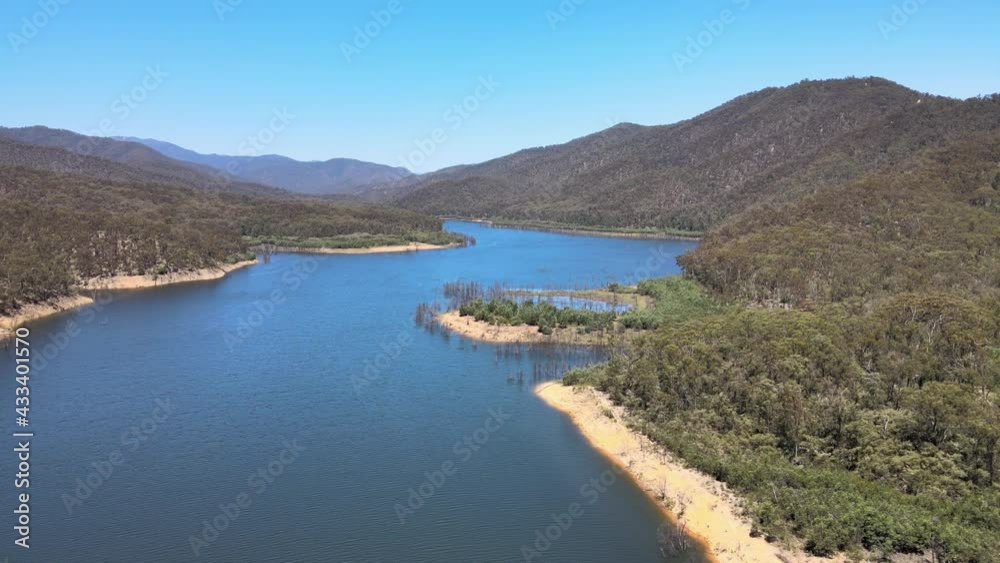 Slow Moving drone shot of Bluewater, Green Bushland, and mountains near Lake Eildon, Victoria Australia Slow Moving drone shot of Bluewater, Green Bushland, and mountains near Lake Eildon, Victoria Australia