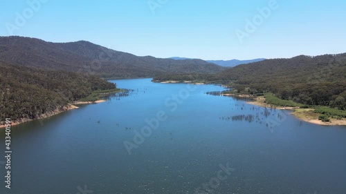 Slow moving drone shot of Bright Blue Water and Mountains near Lake Eildon, Victoria Australia photo