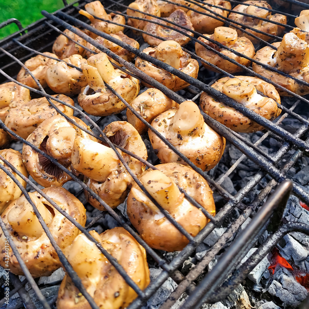 Grilled mushrooms on skewers cooked in a brazier