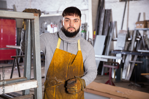 Portrait of confident foreman in workshop. High quality photo