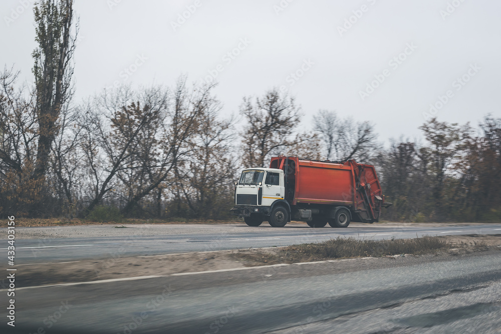 Truck on the road in the autumn