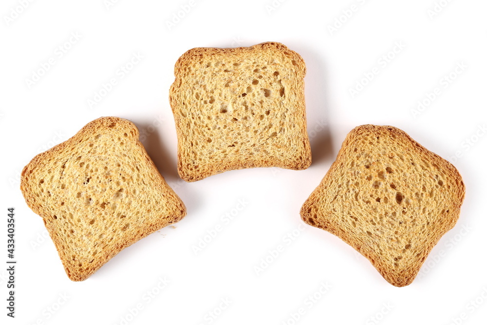 Three wholemeal crackers, bread rusks pile, toast slices isolated on white background, top view Three wholemeal crackers, bread rusks pile, toast slices isolated on white background, top view