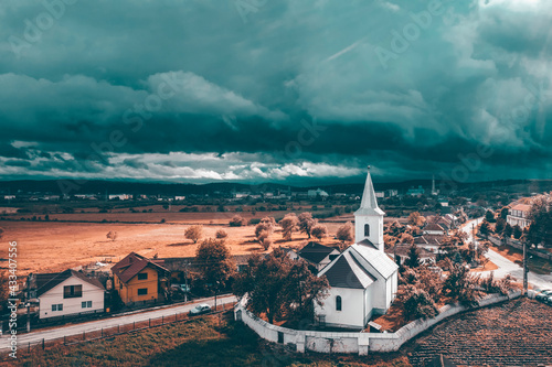 Church beafore storm in Transylvania. Fototapete