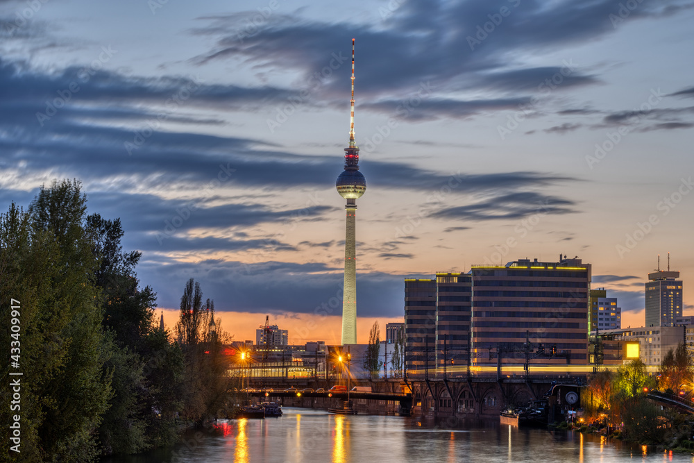 The famous Television Tower and the river Spree in Berlin after sunset
