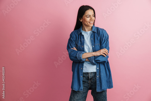 Young hispanic smiling woman posing with arms crossed © Drobot Dean